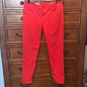 Red ankle zip skinny jeans